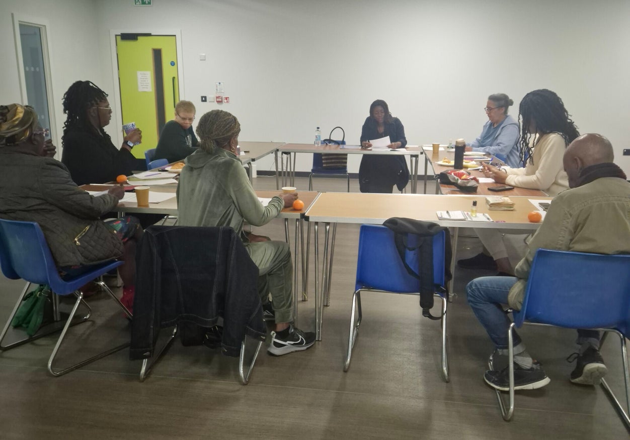 Participants sitting together at a creative writing workshop